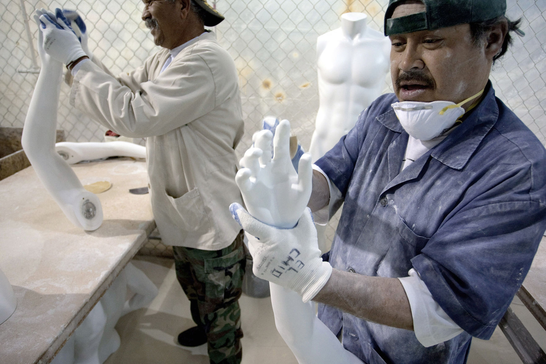 Mexican workers prepare mannequins in a factory in Ciudad Juarez, Chihuahua state.    PHOTO CREDIT: Tribune News Services