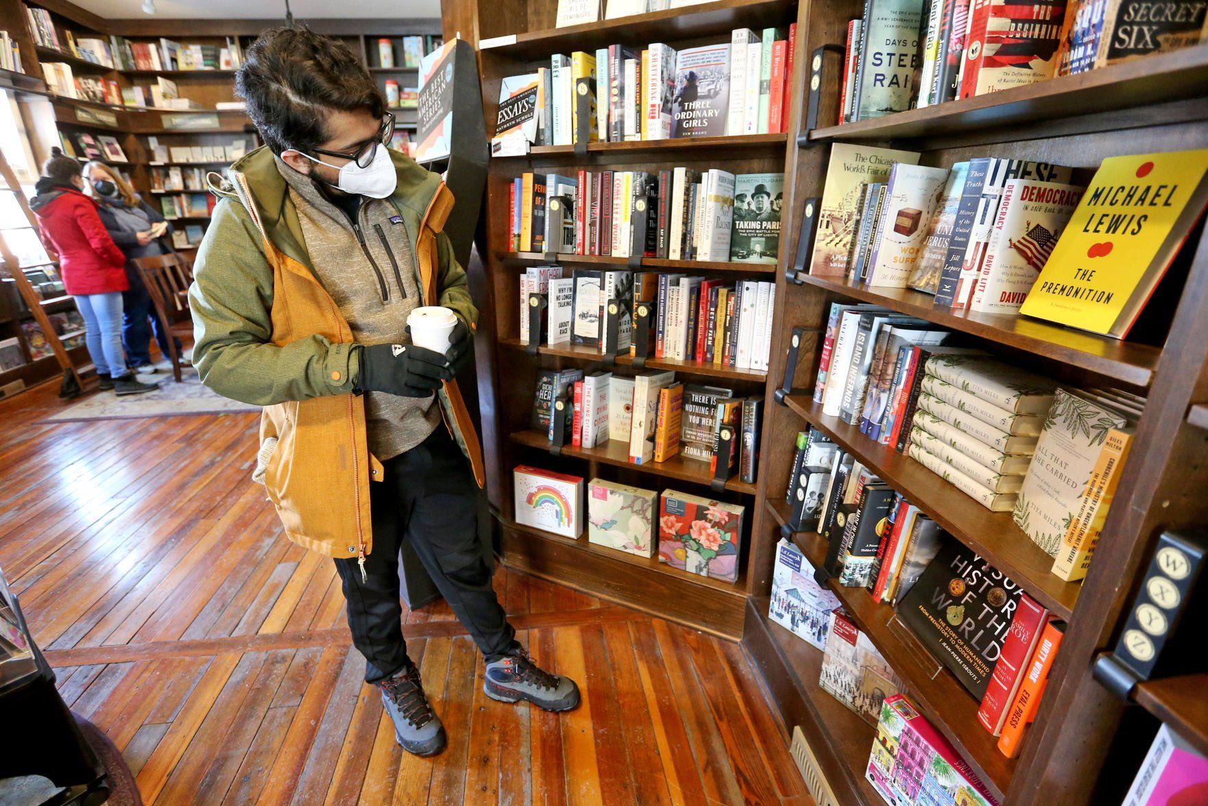Roger Stans, of Chicago, browses a selection of books at River Lights Bookstore in Dubuque on Wednesday.    PHOTO CREDIT: JESSICA REILLY