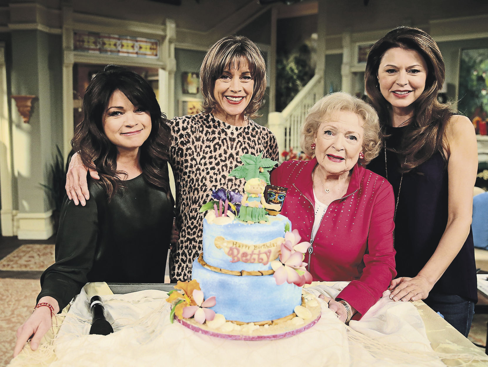 Actresses Valerie Bertinelli (from left), Wendie Malick, Betty White and Jane Leeves pose at the Betty White celebration of her 93rd birthday on the set of “Hot in Cleveland” in 2015. Ray Richmond has written “Betty White: 100 Remarkable Moments in an Extraordinary Life,” about the longtime actress.    PHOTO CREDIT: Tribune News Service
