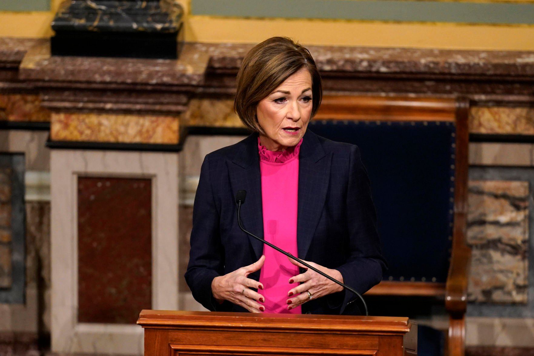Iowa Gov. Kim Reynolds delivers her Condition of the State address before a joint session of the Legislature on Tuesday at the Statehouse in Des Moines.    PHOTO CREDIT: Charlie Neibergall