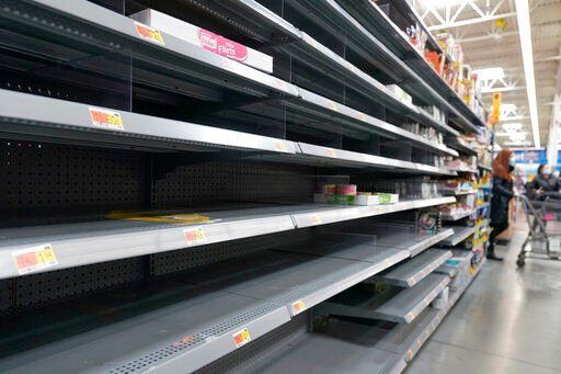 A section of empty shelves is seen at a Walmart store in Teterboro, N.J., Wednesday, Jan. 12, 2022. (AP Photo/Seth Wenig)    PHOTO CREDIT: Seth Wenig