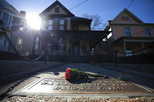 Flowers lay in front of the birthplace of Dr. Martin Luther King, Jr., today in Atlanta. The U.S. economy “has never worked fairly for Black Americans — or, really, for any American of color,” Treasury Secretary Janet Yellen said in a speech delivered today, one of many by national leaders acknowledging unmet needs for racial equality on Martin Luther King Day.    PHOTO CREDIT: Branden Camp