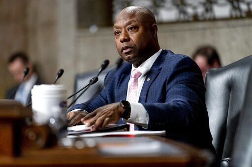 FILE - Sen. Tim Scott, R-S.C., speaks during a Senate Banking Committee hearing on Capitol Hill in Washington, Nov. 30, 2021. The U.S. Senate’s only Black Republican is putting forth what he characterizes as a positive response to partisan rhetoric on race that he’s best-positioned to rebut. Tim Scott of South Carolina tells The Associated Press that he hopes a video series on issues he sees as pertinent to the Black community will help refocus a fraught national conversation on race. Scott has timed the release in conjunction with Martin Luther King Jr. Day. (AP Photo/Andrew Harnik, File)    PHOTO CREDIT: Andrew Harnik