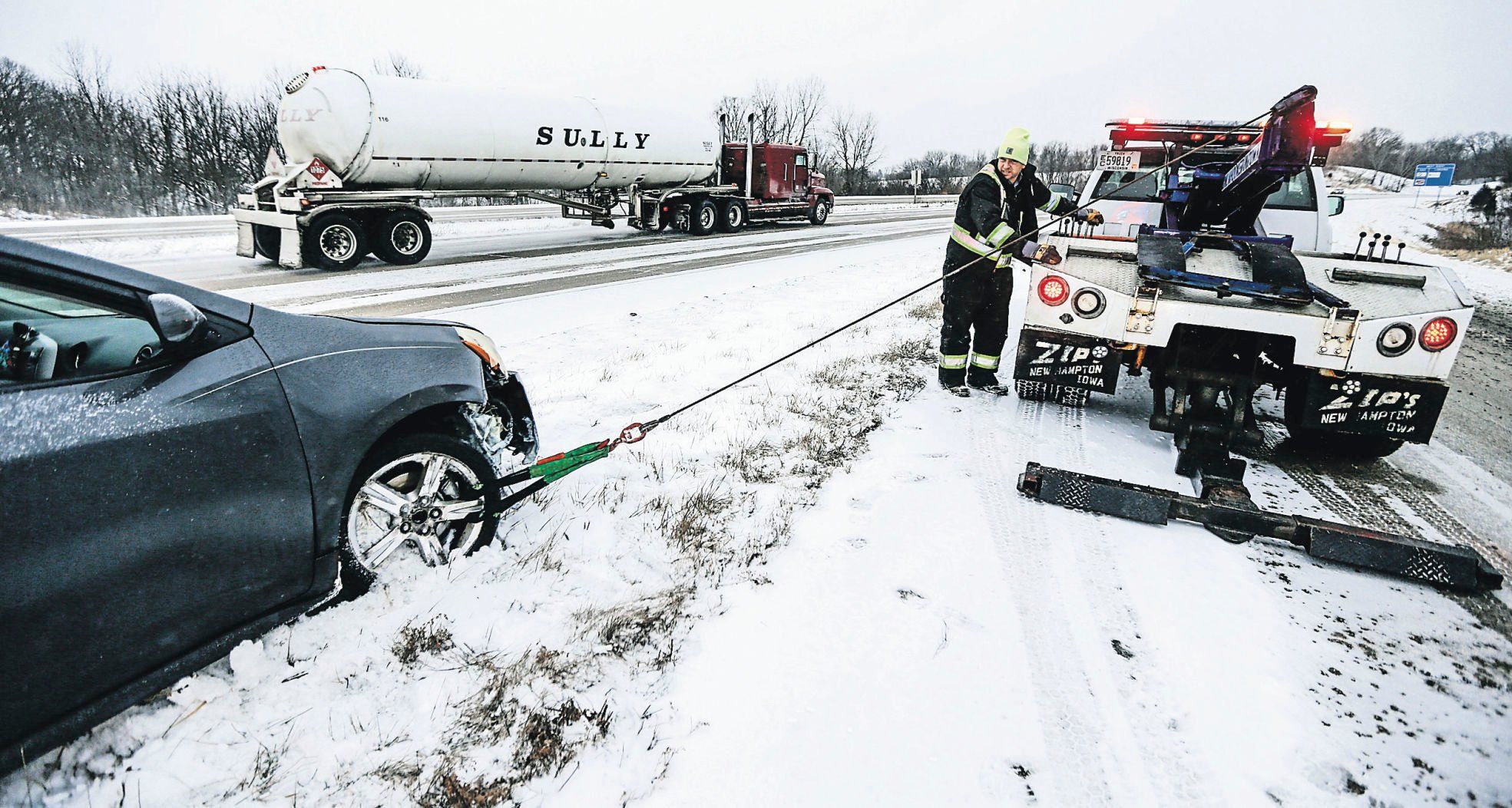 Towing companies handle incidents from winch-outs of stuck vehicles to jump starting others.    PHOTO CREDIT: Dave Kettering