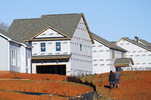 New homes are seen under construction in Mebane, N.C., Monday, Jan. 10, 2022. Construction of new homes in the U.S. rose again in December as builders ramp up projects amid a persistent shortage of homes. The December increase left home construction at a seasonally adjusted annual rate of 1.70 million units, the Commerce Department reported Wednesday, Jan. 19, the third straight monthly gain. .(AP Photo/Gerry Broome)    PHOTO CREDIT: Gerry Broome
