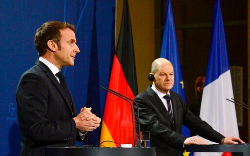 French President Emmanuel Macron, left, and German Chancellor Olaf Scholz attend a media conference head of their meeting at the chancellery in Berlin, Germany, Tuesday, Jan. 25, 2022. German and French leaders are meeting in Berlin over the Ukraine crisis and other European issues. (Tobias Schwarz/Pool Photo via AP, File)    PHOTO CREDIT: Tobias Schwarz