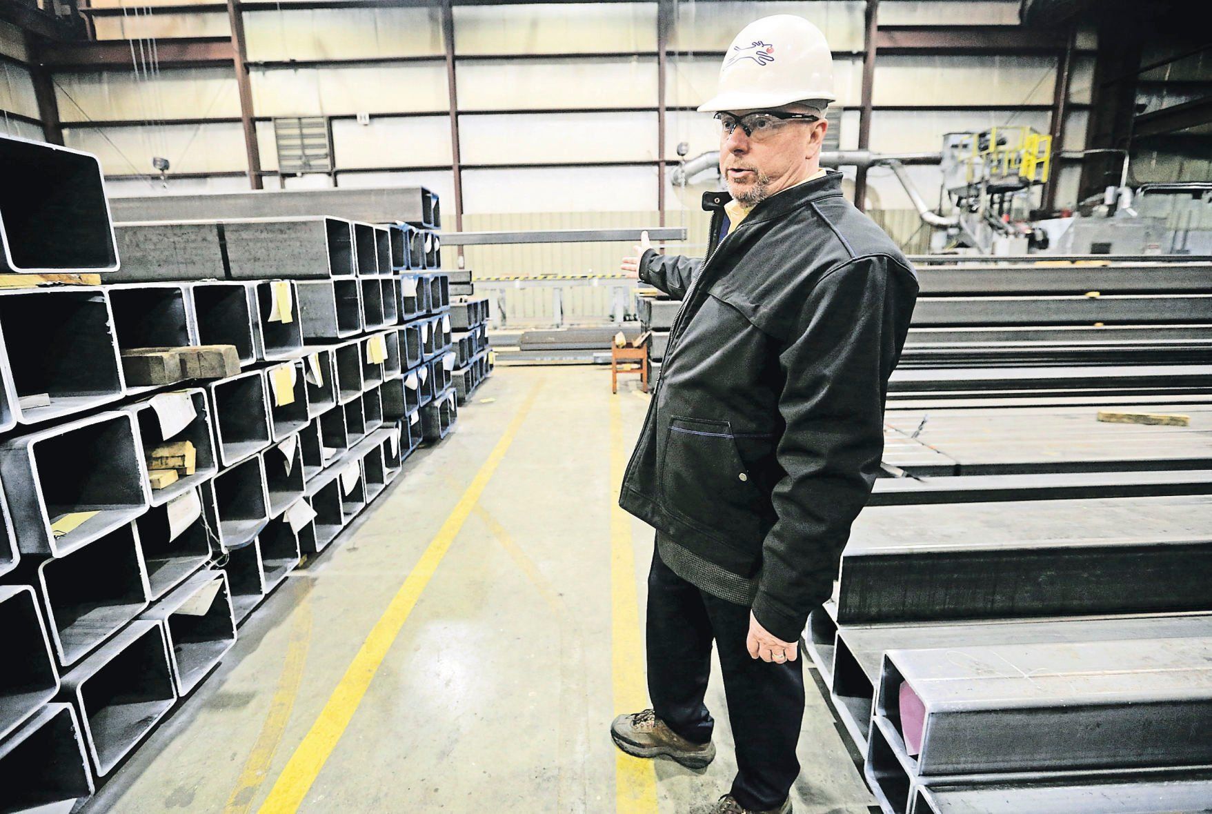 Jim Boedeker, regional general manager of Kloeckner Metals, gives a tour at the facility in Dubuque.    PHOTO CREDIT: JESSICA REILLY