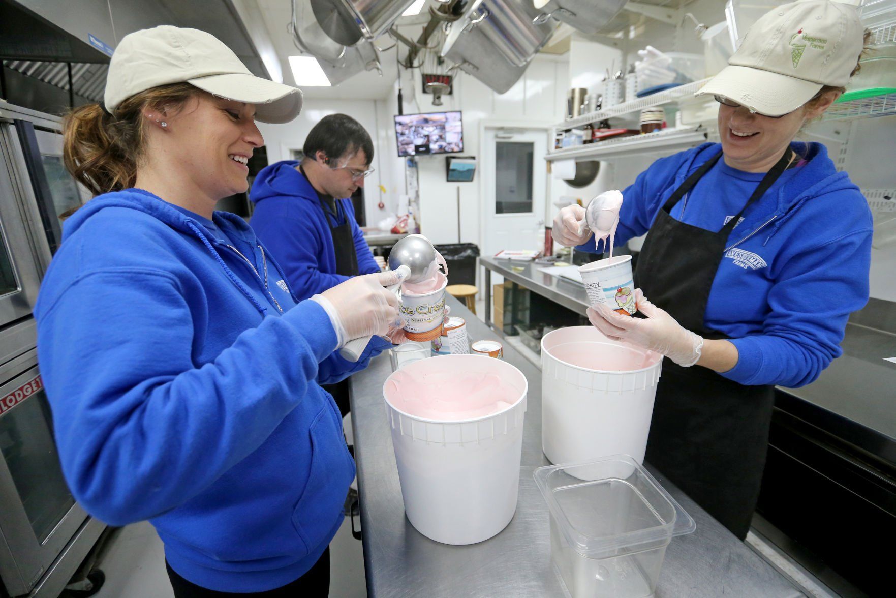 Whitney Beyer (from left), Kyle Vesperman and Morgan Spitzer package ice cream at Vesperman Farms in Lancaster, Wis., on Monday.    PHOTO CREDIT: JESSICA REILLY