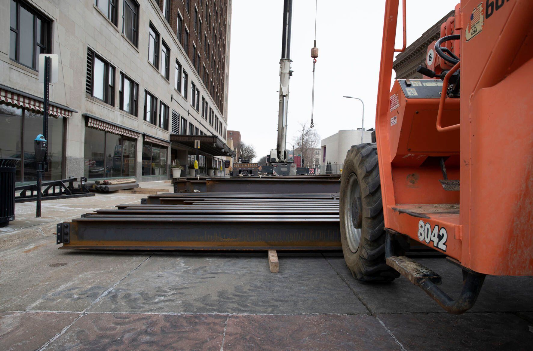 A crane and materials block Locust Street as construction continues on the Roshek Building in Dubuque on Wednesday, Feb. 2, 2022.    PHOTO CREDIT: Stephen Gassman
