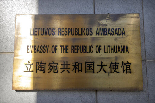 FILE - The nameplate for the Lithuanian Embassy is seen on the outside of the embassy building in Beijing, on Dec. 16, 2021. More countries have asked this week to join talks about the European Union’s complaint with the World Trade Organization accusing China of exerting economic pressure on Lithuania. Canada was the latest Thursday, Feb. 10, 2022 saying it wanted to take part in WTO consultations over a dispute tied to Taiwan opening a diplomatic office in the EU member country. (AP Photo/Mark Schiefelbein, File)    PHOTO CREDIT: Mark Schiefelbein