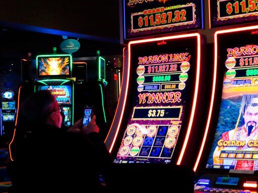 A customer playing a slot machine at the Ocean Casino Resort on Feb. 10, 2022 in Atlantic City N.J. On Tuesday, Feb. 15, the American Gaming Association released figures showing that U.S. commercial casinos won $53 billion in 2021, making it the gambling industry