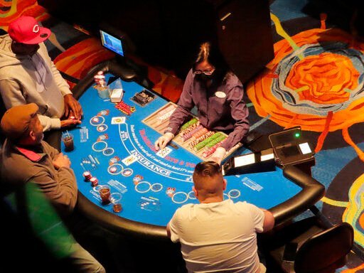A card game is under way at the Ocean Casino Resort on Feb. 10, 2022 in Atlantic City N.J. On Tuesday, Feb. 15, the American Gaming Association released figures showing that U.S. commercial casinos won $53 billion in 2021, making it the gambling industry