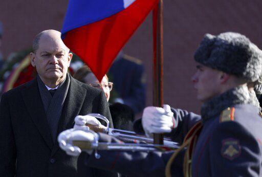 German Chancellor Olaf Scholz attends a wreath-laying ceremony at the Tomb of the Unknown Soldier at the Kremlin Wall in Moscow, Russia, Tuesday, Feb. 15, 2022. Scholz met Tuesday with Russian President Vladimir Putin in Moscow, a day after sitting down with Ukraine