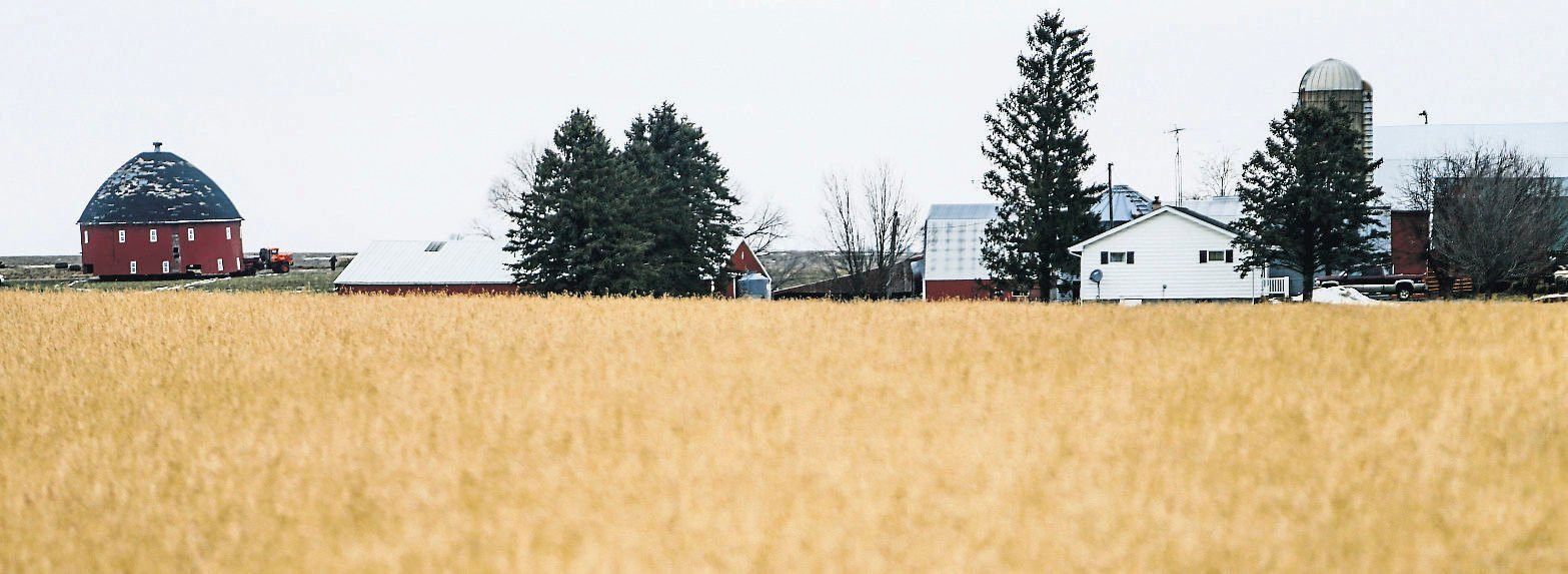 Crews work on moving a 60-foot round barn through a farm field near Old Potosi Road in Lancaster, Wis., on Thursday, Feb. 17, 2022. Vesperman Farms is moving the barn to its property a few miles away.    PHOTO CREDIT: Dave Kettering