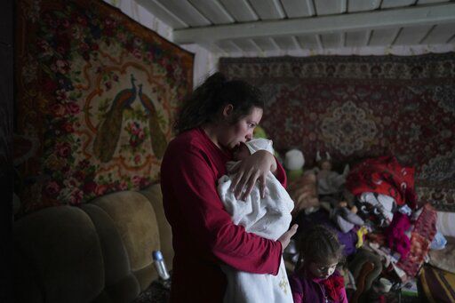 Anastasia Manha, 23, lulls her 2-month-old son Mykyta, in Novognativka, eastern Ukraine, after alleged shelling by separatists forces. The U.S. and Russian presidents have tentatively agreed to meet in a last-ditch diplomatic effort to stave off Moscow