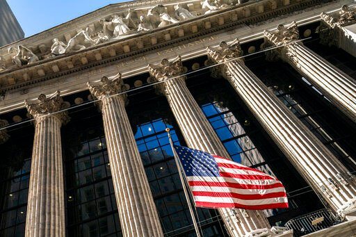 FILE - A U.S. flag waves outside the New York Stock Exchange, Monday, Jan. 24, 2022, in New York. Stocks are continuing a three-day skid on Wall Street, Tuesday, Feb. 22, after Western powers fear Russia might use skirmishes in Ukraine’s eastern regions as a pretext for an attack on the democracy. (AP Photo/John Minchillo, File)    PHOTO CREDIT: John Minchillo