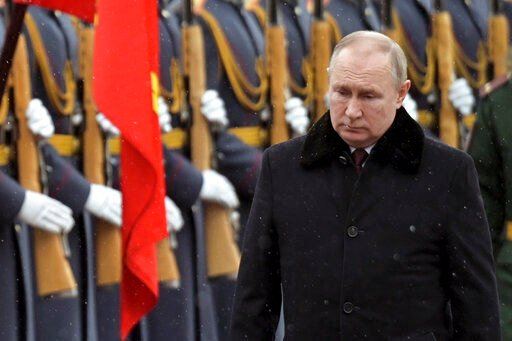 Russian President Vladimir Putin attends a wreath-laying ceremony at the Tomb of the Unknown Soldier, near the Kremlin Wall during the national celebrations of the 
