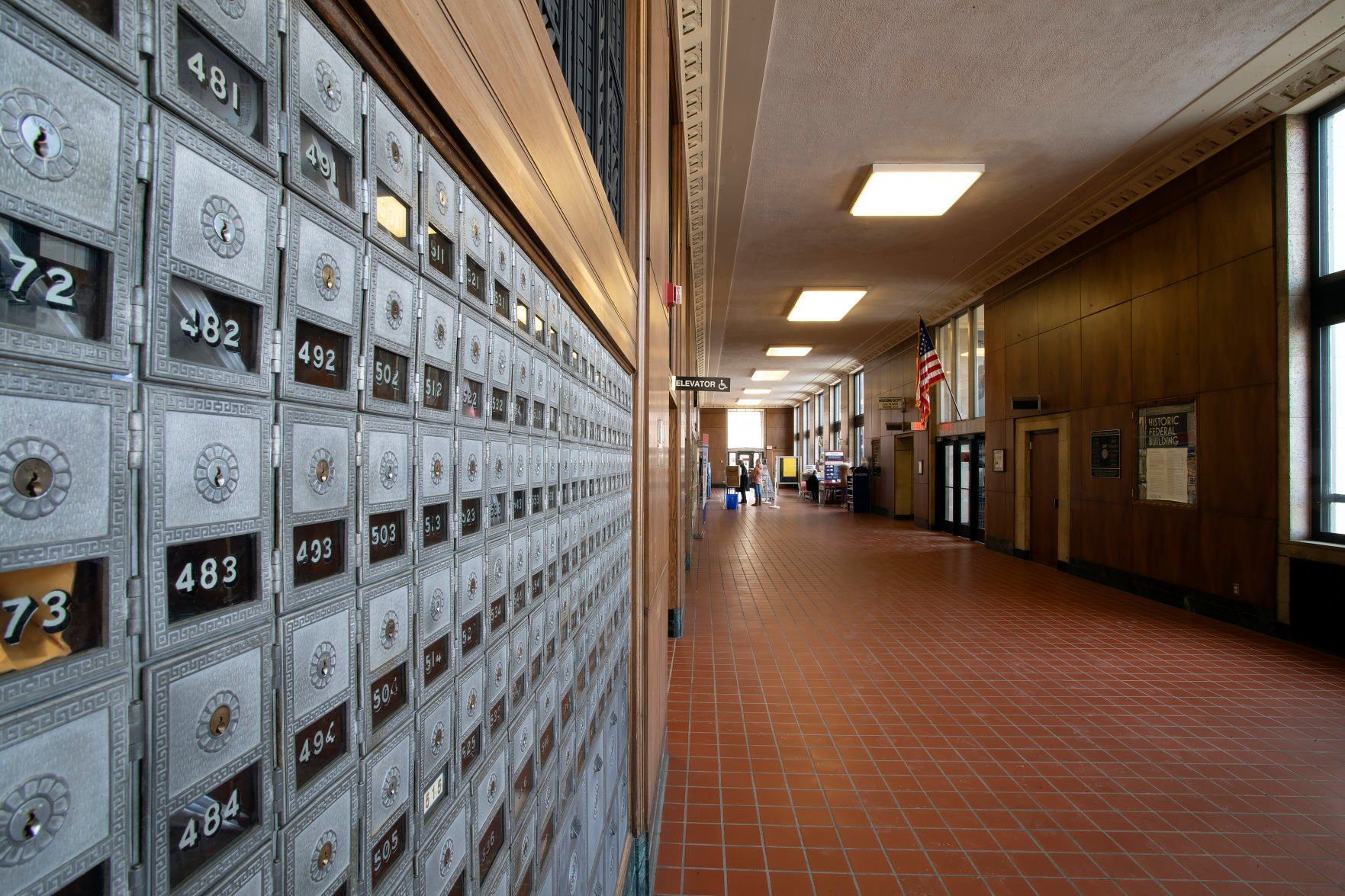 Post office boxes line the walls in the lobby of the post office located inside the historic Federal Building in Dubuque on Wednesday, Feb. 23, 2022.    PHOTO CREDIT: Stephen Gassman