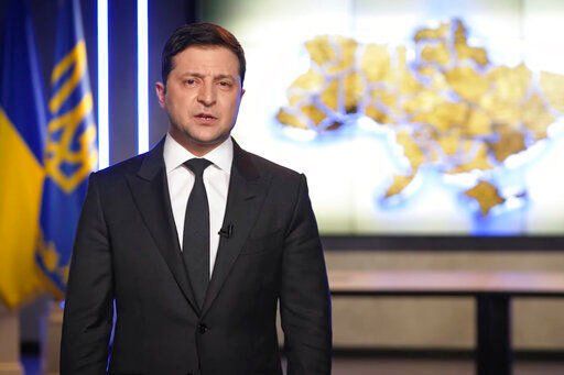 In this handout photo taken from video provided by the Ukrainian Presidential Press Office, Ukrainian President Volodymyr Zelenskyy addresses the nation in Kyiv, Ukraine, Thursday, Feb. 24, 2022. Zelenskyy declared martial law, saying Russia has targeted Ukraine