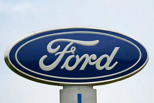 FILE - A Ford logo is seen on signage at Country Ford in Graham, N.C., Tuesday, July 27, 2021. Ford is recalling nearly a quarter-million heavy duty pickup trucks in the U.S., Thursday, Feb. 24, 2022, because the drive shafts can fracture and cause a loss of power. The recall covers certain F-250 and F-350 Super Duty pickups from the 2017 through 2022 model years. The trucks have gasoline engines and aluminum drive shafts. (AP Photo/Gerry Broome, File)    PHOTO CREDIT: Gerry Broome