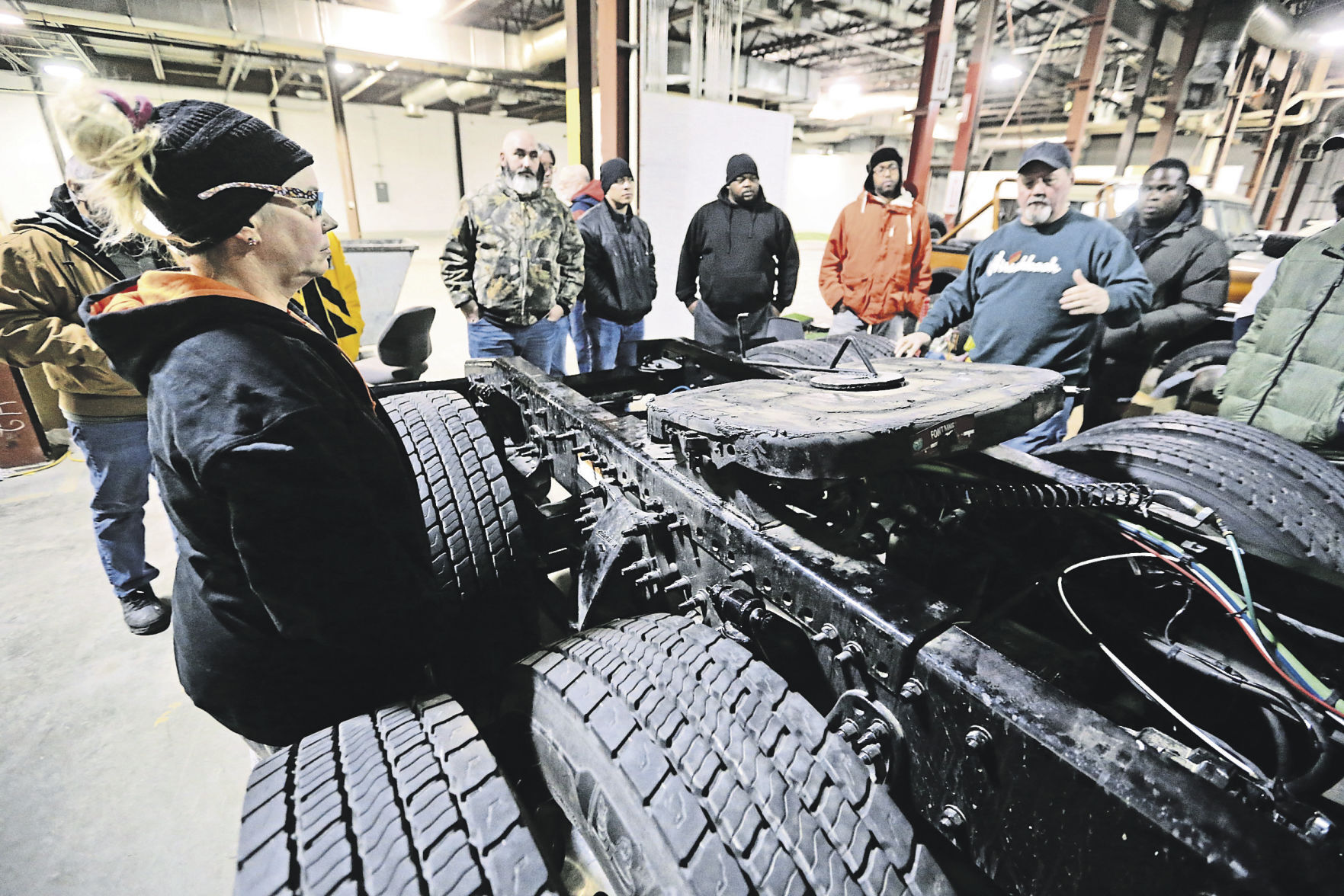 Kris Kernall (right), an instructor at Hirschbach Motor Lines, explains a lesson.    PHOTO CREDIT: JESSICA REILLY