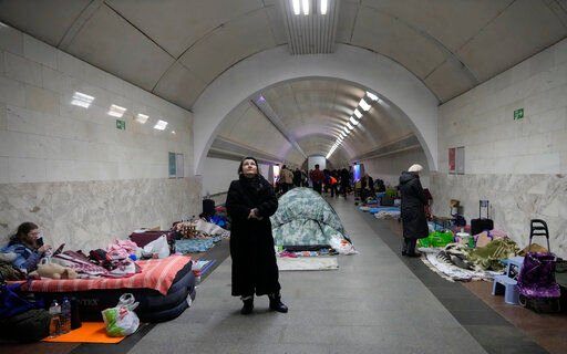 People gather in the Kyiv subway, using it as a bomb shelter in Kyiv, Ukraine, Wednesday, March 2, 2022. Russian forces have escalated their attacks on crowded cities in what Ukraine