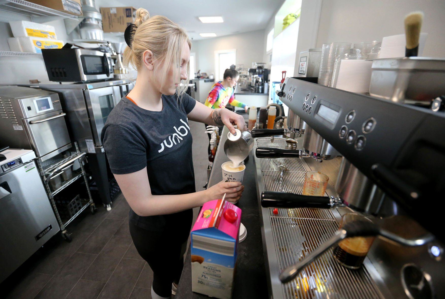 Christiana Merfeld makes a drink for a customer at Jumble Coffee Co. in Peosta, Iowa, on Monday, March 7, 2022. The Thunder Valley Drive location opened on Monday.    PHOTO CREDIT: JESSICA REILLY