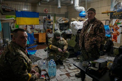 Members of the territorial defense rest in a movie theater in Kyiv, Ukraine, Monday, March 7, 2022. (AP Photo/Vadim Ghirda)    PHOTO CREDIT: Vadim Ghirda