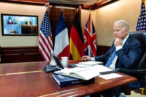 President Joe Biden listens during a secure video call with French President Emmanuel Macron, German Chancellor Olaf Scholz and British Prime Minister Boris Johnson in the Situation Room at the White House. Biden has decided to ban Russian oil imports, toughening the toll on Russia’s economy in retaliation for its invasion of Ukraine, according to a person familiar with the matter.    PHOTO CREDIT: Adam Schultz