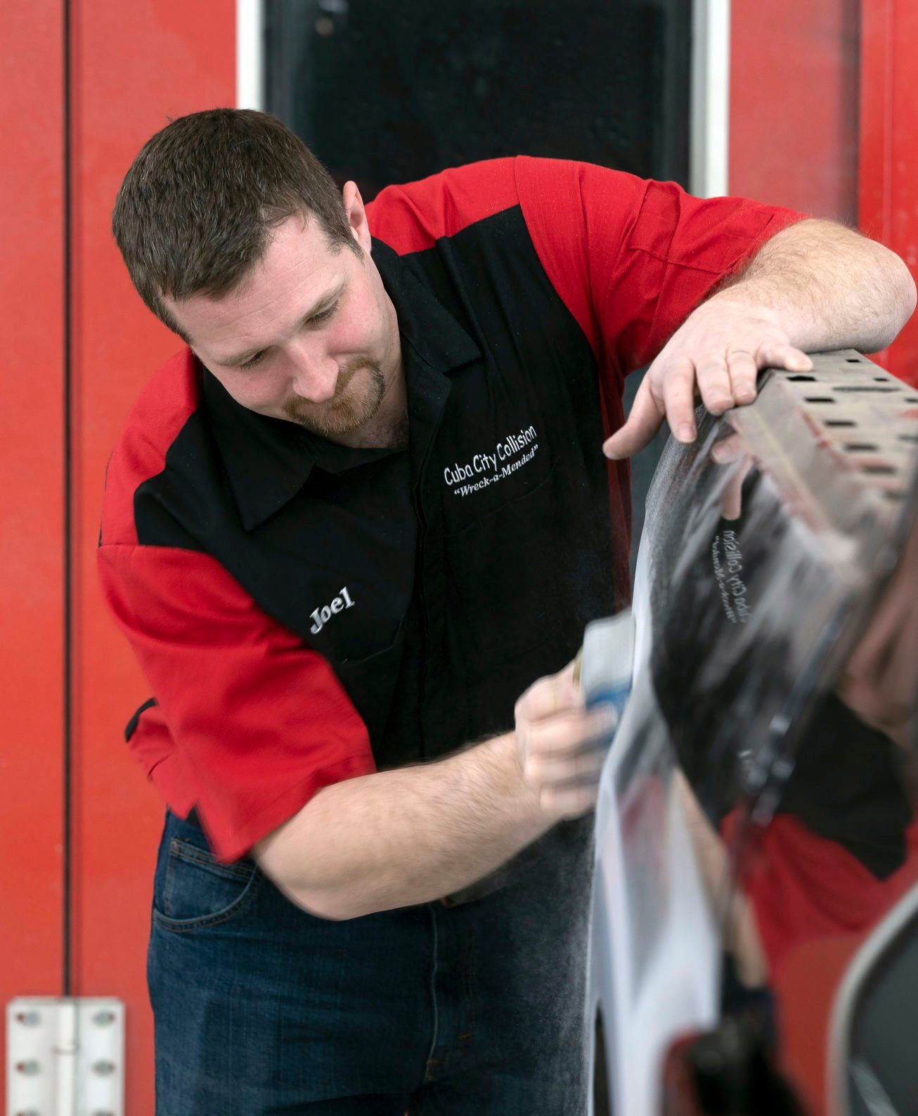 Cuba City Collision owner Joel Groom works on a truck at his business in Cuba City, Wis., on Wednesday, March 9, 2022.    PHOTO CREDIT: Stephen Gassman