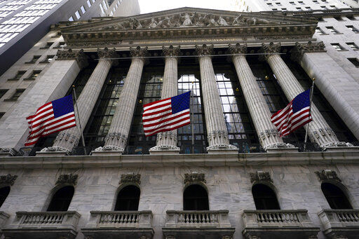 FILE - American flags fly outside the New York Stock exchange, Friday, Jan. 14, 2022, in the Financial District in New York. Stocks are climbing on Wall Street Tuesday, March 15, as inflation worries ebb and oil prices slide(AP Photo/Mary Altaffer, File)    PHOTO CREDIT: Mary Altaffer