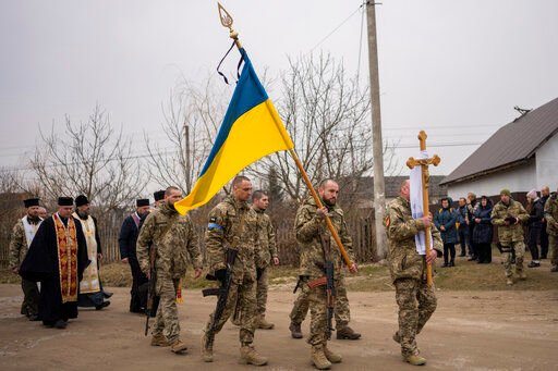 Funeral procession of Ukrainian military servicemen Roman Rak and Mykola Mykytiuk in Starychi, western Ukraine, Wednesday, March 16, 2022. Rak and Mykytiu were killed during Sunday