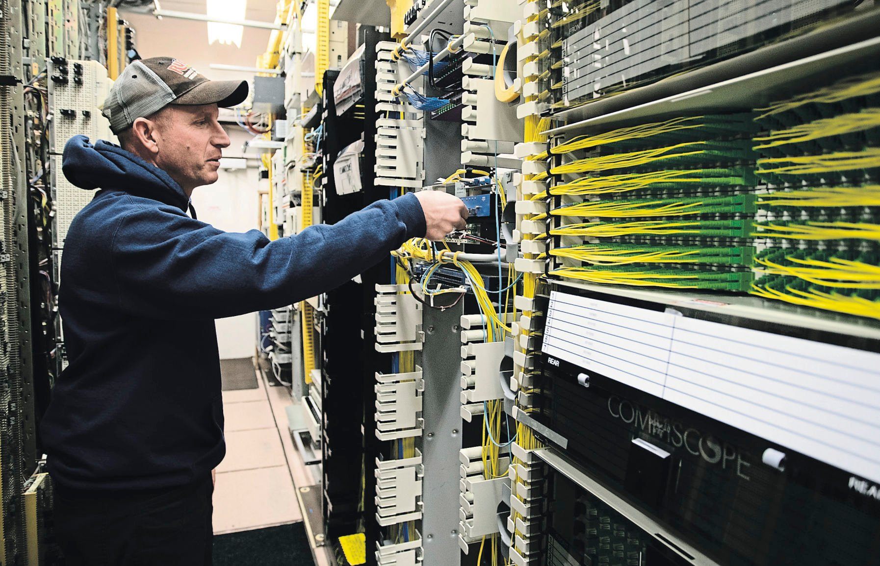 Technician Jerry Cullen works with the new switching technology.    PHOTO CREDIT: Stephen Gassman