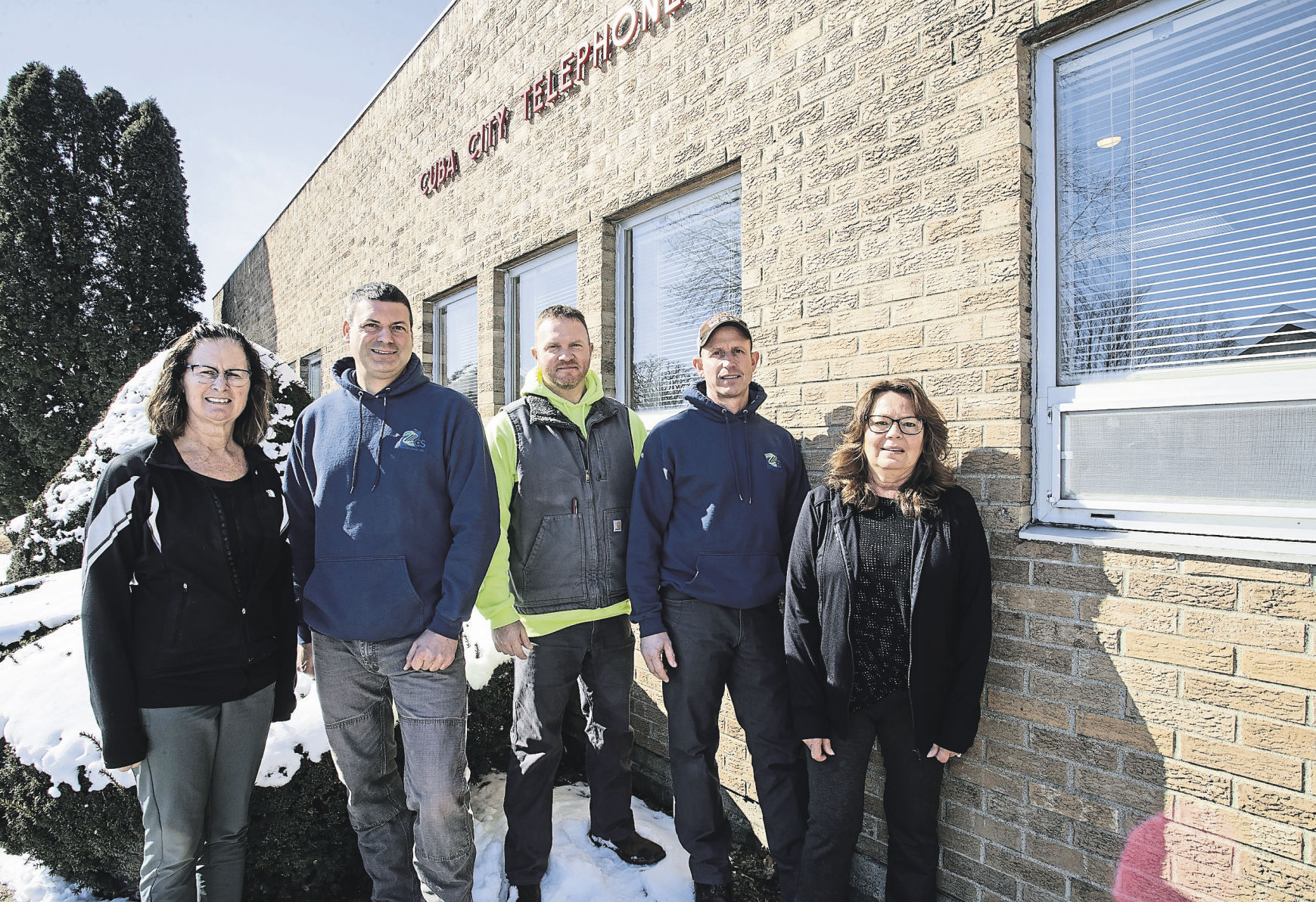 Cuba City Telephone Co. employees Deb Schuppener, Nick Averkamp, Jesse Longhenry, Jerry Cullen and Dayna Wieberding stand in front of the longtime Cuba City, Wis., business.    PHOTO CREDIT: SYSTEM