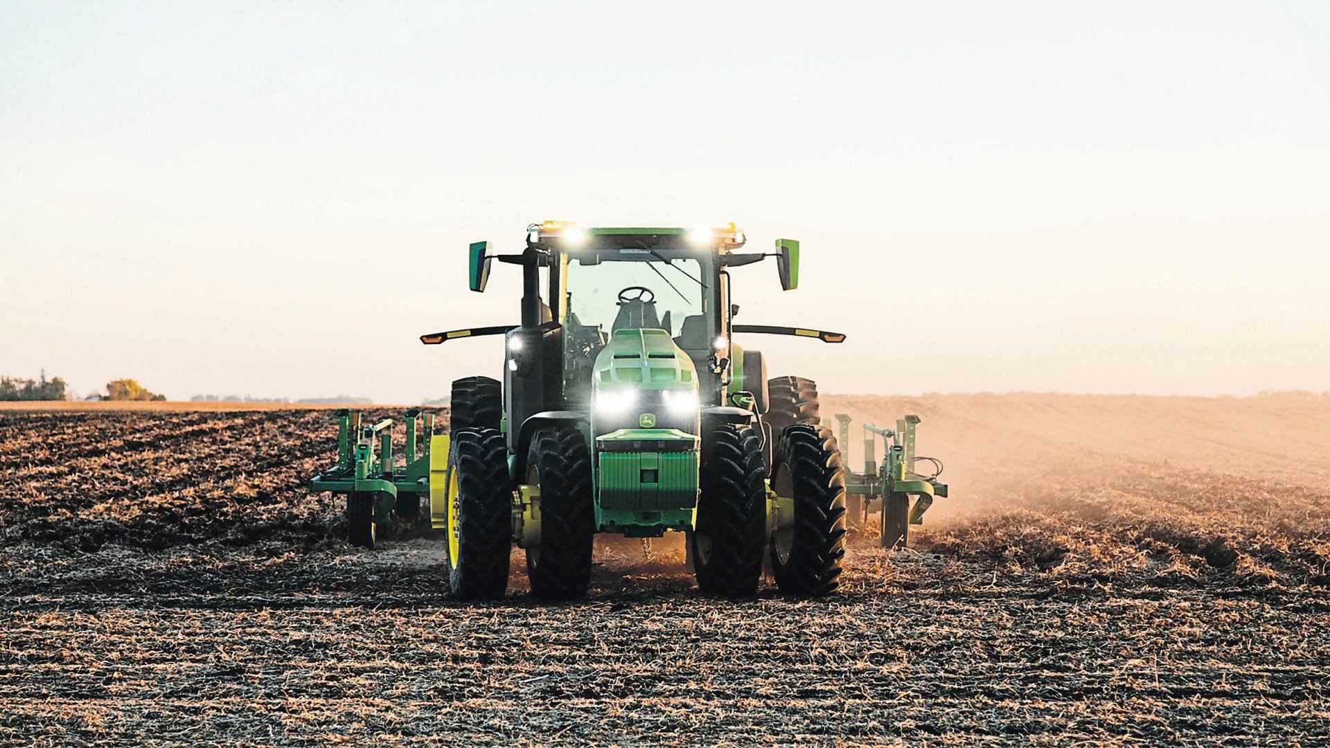 This 2021 photo provided by John Deere shows an autonomous tractor plowing a field, without a driver, on a farm in Blue Earth, Minn. The company will increase the number of tests on farms this year. Backers of the technology say such tractors can help farmers optimize their work when weather conditions are ideal.    PHOTO CREDIT: Bill Krzyzanowski