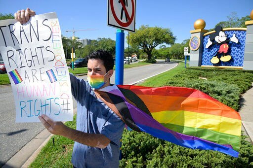 Disney cast member Nicholas Maldonado protests his company’s stance on LGBTQ issues during an employee walkout at Walt Disney World on Tuesday in Lake Buena Vista, Fla.    PHOTO CREDIT: Phelan M. Ebenhack