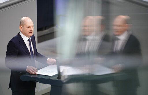German Chancellor Olaf Scholz delivers a speech during a budget debate as part of a meeting of the German federal parliament, Bundestag, at the Reichstag building in Berlin, Germany, Wednesday, March 23, 2022. (Kay Nietfeld/dpa via AP)    PHOTO CREDIT: Kay Nietfeld