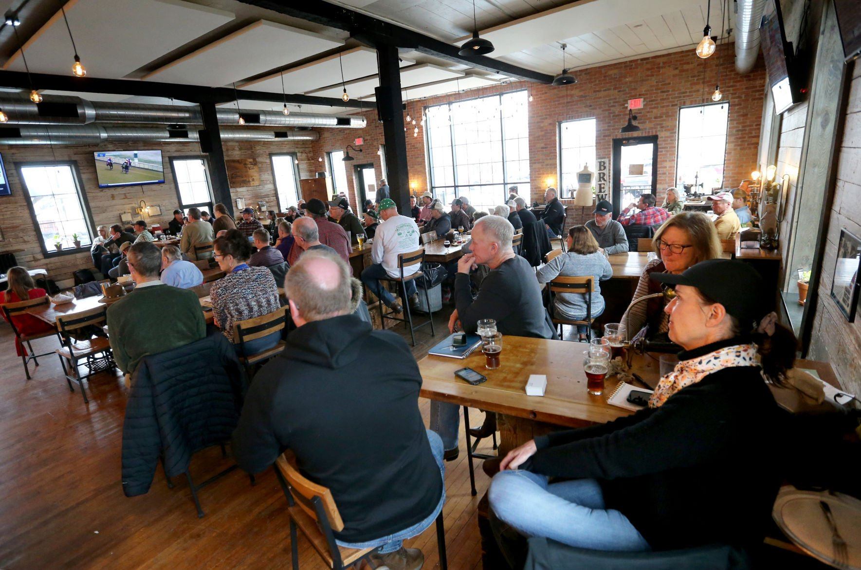 Attendees listen to presentations during a Farm to Brew event at Textile Brewing Co. in Dyersville, Iowa, on Wednesday, March 30, 2022.    PHOTO CREDIT: JESSICA REILLY