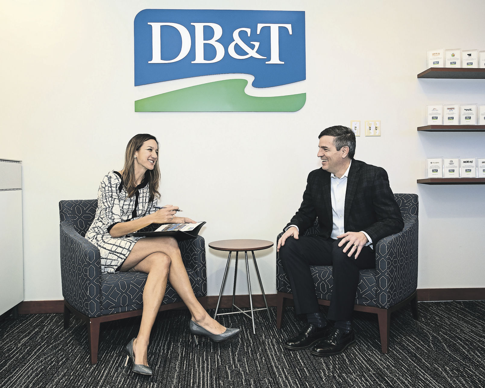 Eric Foy, vice president, business development manager of Dubuque Bank & Trust, talks with Stacey Hines at the Central Avenue location in Dubuque on Tuesday, March, 1, 2022.    PHOTO CREDIT: Stephen Gassman