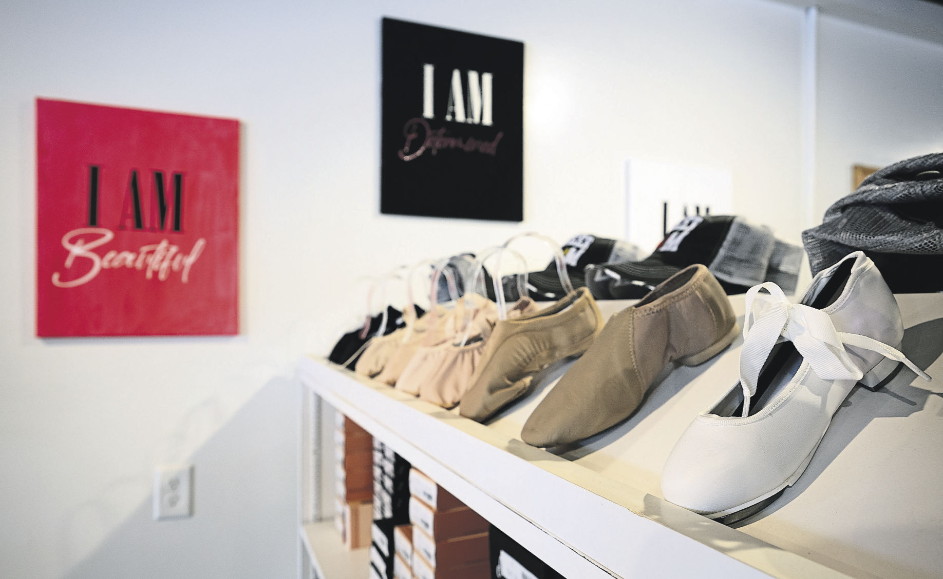 Shoes line a shelf at Beauty in Motion Dancewear Boutique.    PHOTO CREDIT: Stephen Gassman