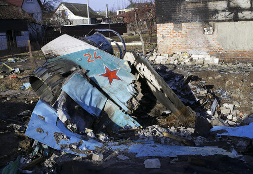 Fragments of a Russian jet fighter on a private house in Chernihiv, Ukraine, Wednesday, April 6, 2022. Russia retreated from areas around Kyiv and the northern cities of Chernihiv and Sumy after talks with Ukraine in Turkey last week. (AP Photo/Stas Yurchenko)    PHOTO CREDIT: Stas Yurchenko