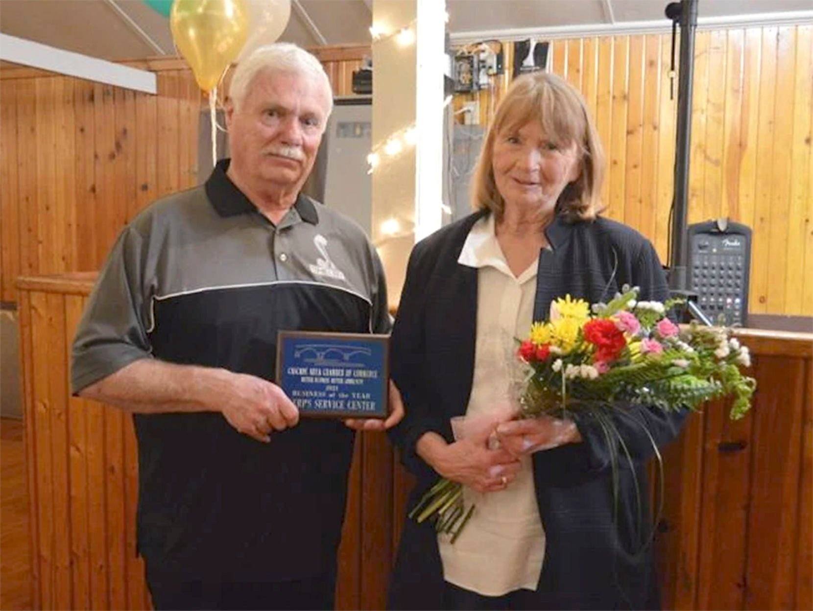 Rick and Deb Kerper are awarded the Cascade Area Chamber of Commerce’s Business of the Year Award.    PHOTO CREDIT: Daniel Charland