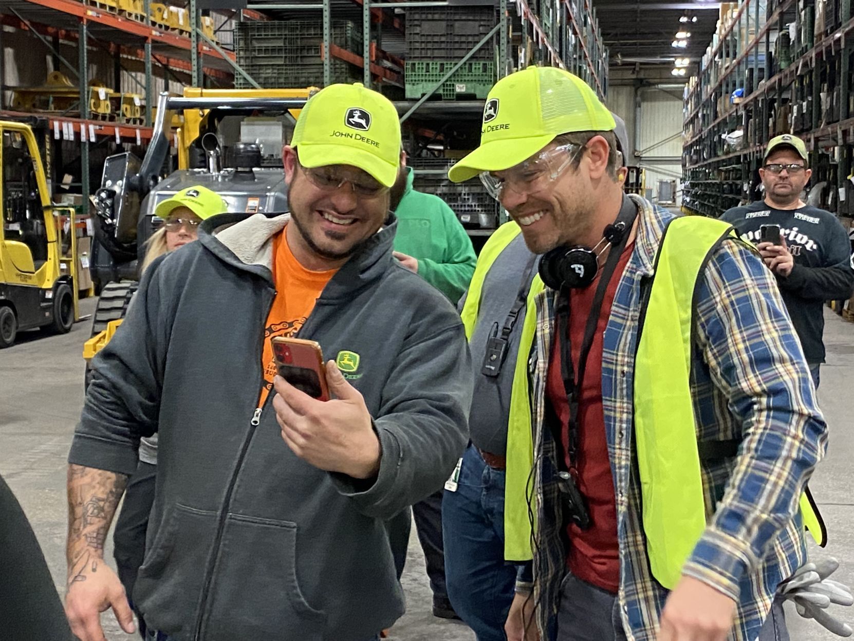 Country music star Dustin Lynch (right) and a John Deere Dubuque Works employee during the tour of the plant on Thursday.     PHOTO CREDIT: Contributed