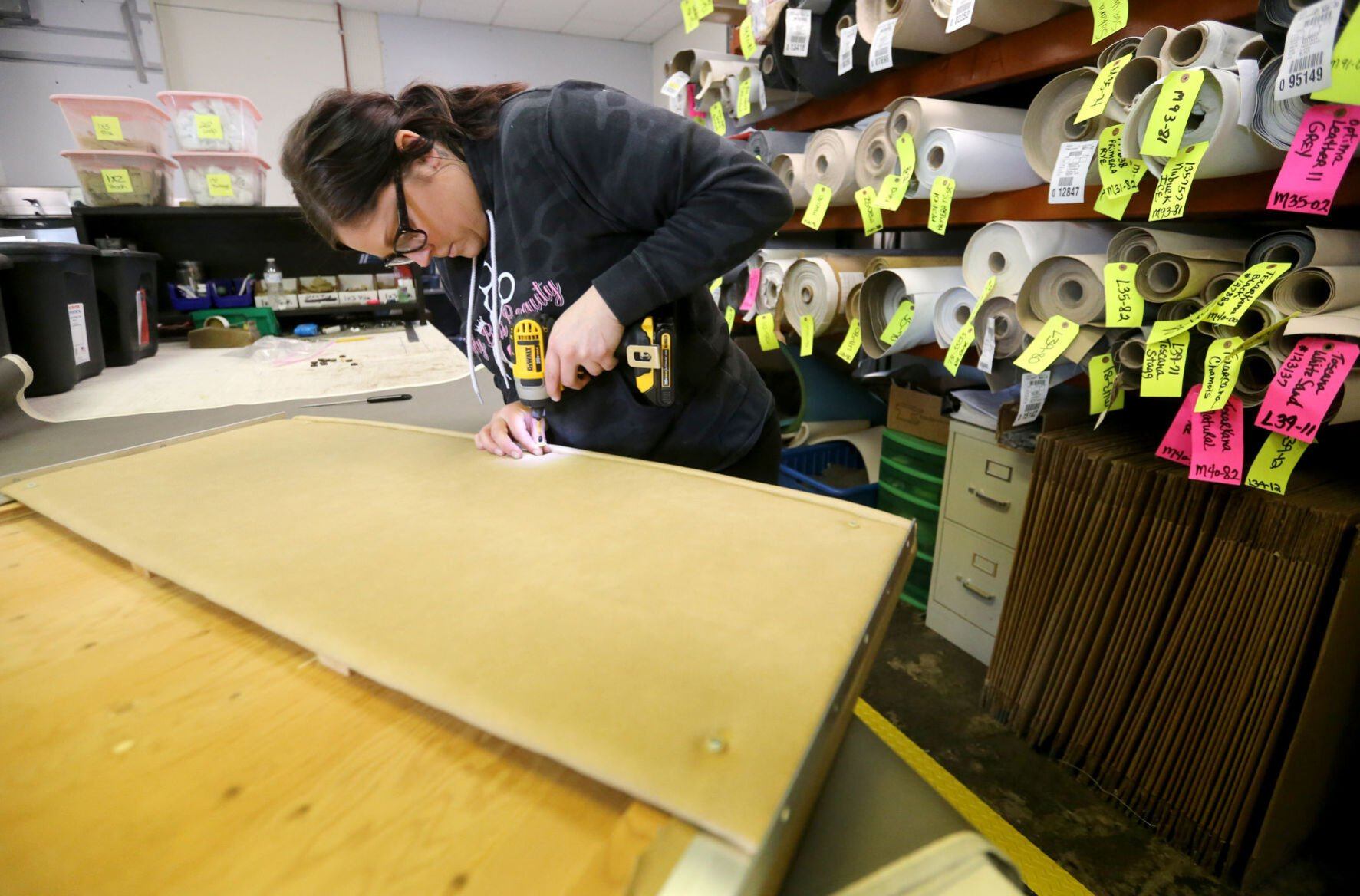 Brooke Bernhardt assembles a panel for a recreational vehicle dining table at Bauer RV Upholstery in Dickeyville, Wis., on Monday, April 11, 2022.    PHOTO CREDIT: JESSICA REILLY