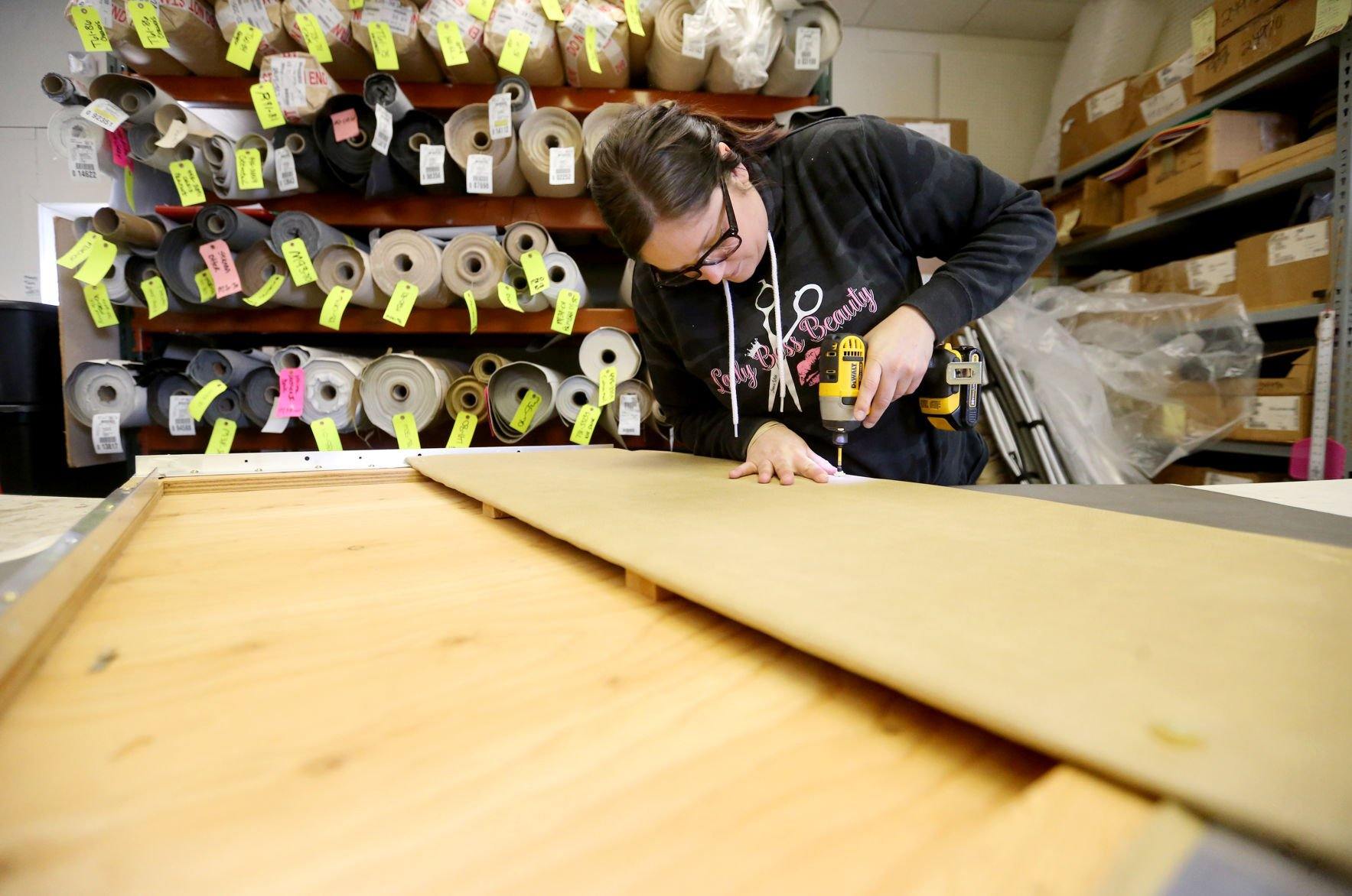 Brooke Bernhardt assembles a panel for a recreational vehicle dining table at Bauer RV Upholstery in Dickeyville, Wis., on Monday, April 11, 2022.    PHOTO CREDIT: JESSICA REILLY