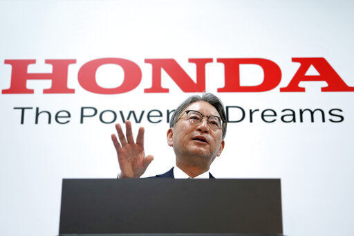 Honda Motor Co. Chief Executive Toshihiro Mibe answers questions from media during a press conference today in Tokyo. Honda is investing $40 billion over the next decade in research, especially to realize a major shift to ecological electric vehicles.     PHOTO CREDIT: Eugene Hoshiko