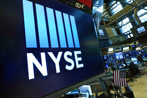 FILE - Logos the New York Stock Exchange adorn trading posts, on the floor, Wednesday, March 16, 2022. Stocks are opening higher and bond yields are falling, Tuesday, April 12, as investors cling to strands of hope in mostly discouraging report on inflation. (AP Photo/Richard Drew, File)    PHOTO CREDIT: Richard Drew