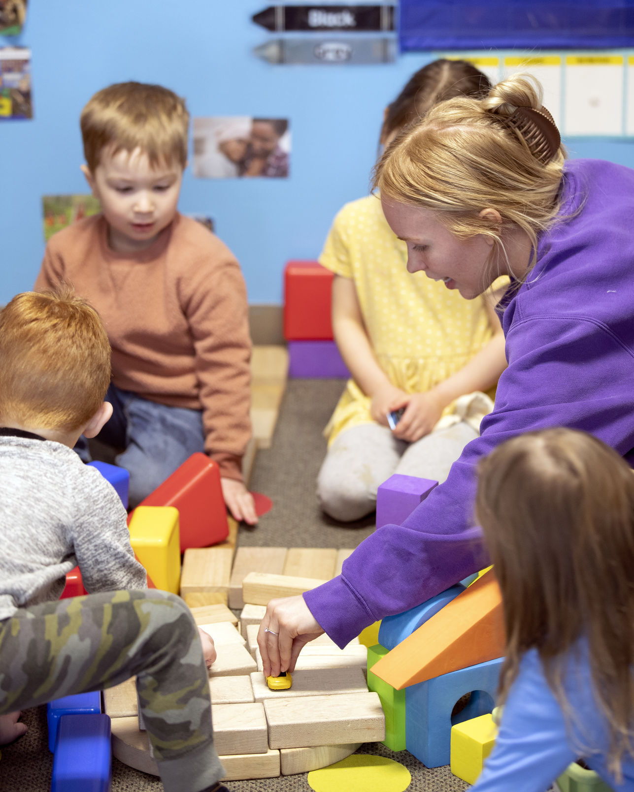 Young-Uns Child Care teacher Mariah McNamara plays with the 3-year-olds at the center on Monday, April 18, 2022.    PHOTO CREDIT: Stephen Gassman