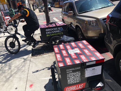A worker sets to make a delivery on a bicycle in front of Gorillas mini-warehouse in the Williamsburg section of the Brooklyn borough of New York. Gorillas is one of several companies that venture capitalists have poured billions into in the latest pandemic delivery craze.    PHOTO CREDIT: Tali Arbel