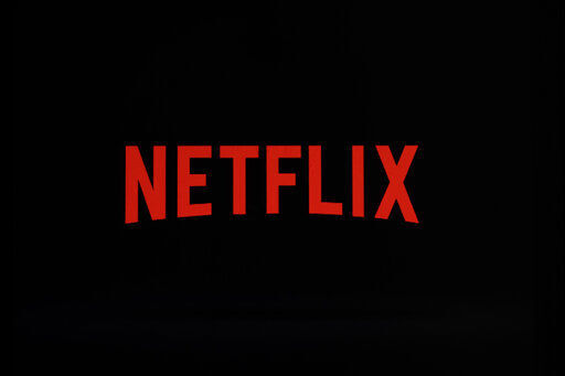 Netflix is confronting a reckoning that will result in new barriers to prevent its video streaming service’s subscribers from sharing their passwords beyond their households and possibly inject ads into its programming line-up for the first time.     PHOTO CREDIT: Matt Rourke